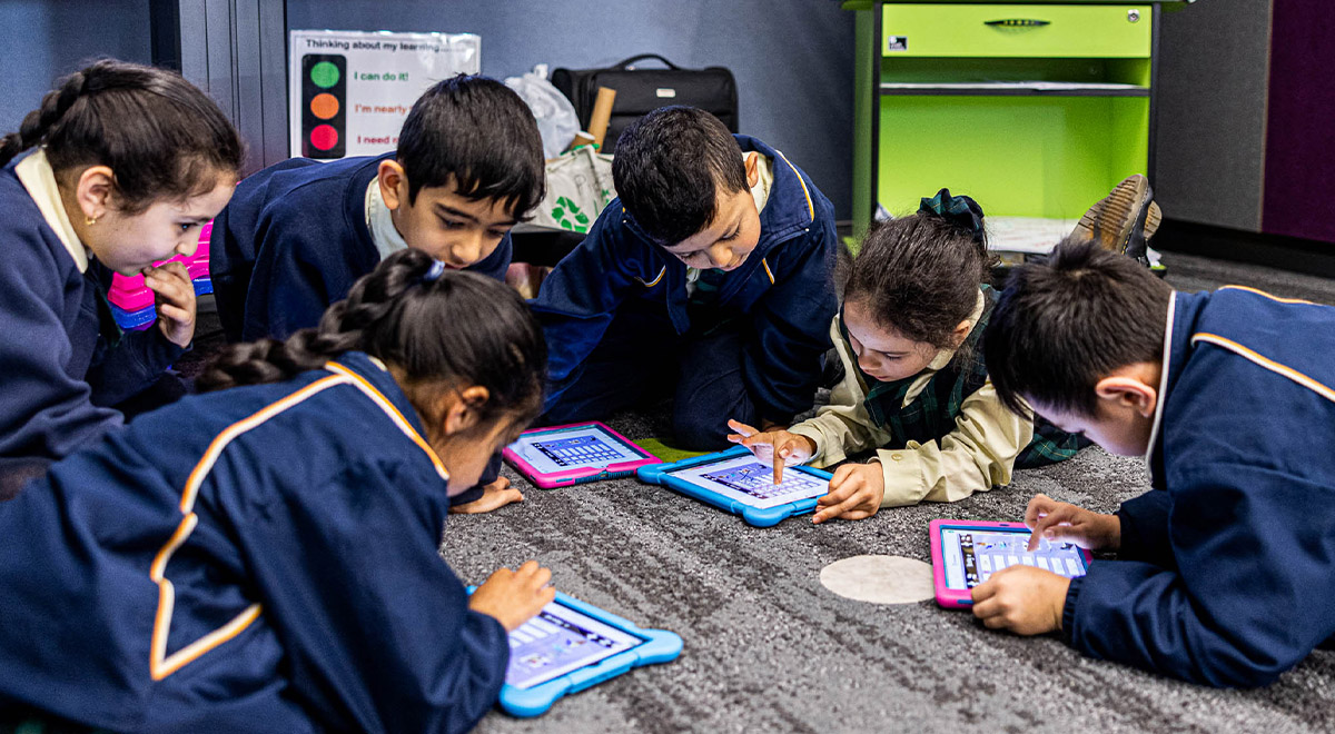 Children on tablets at St Francis of Assisi Catholic Primary School Glendenning