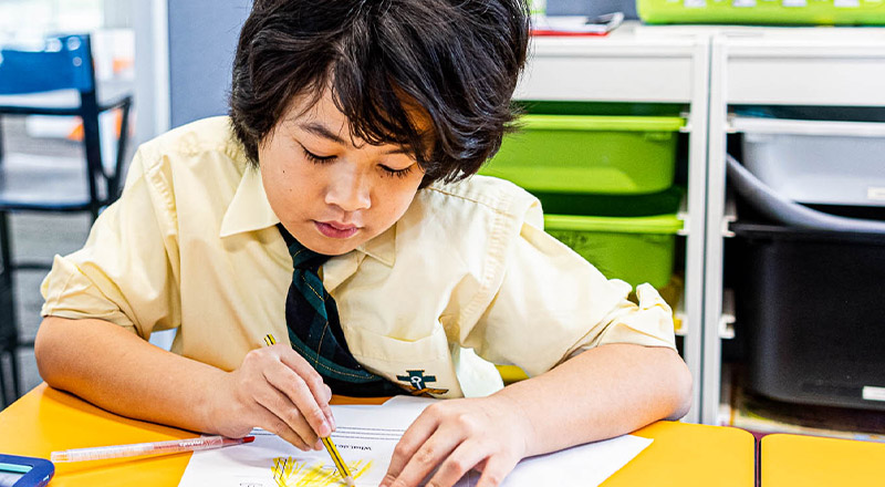 Student at desk at St Francis of Assisi Catholic Primary School Glendenning