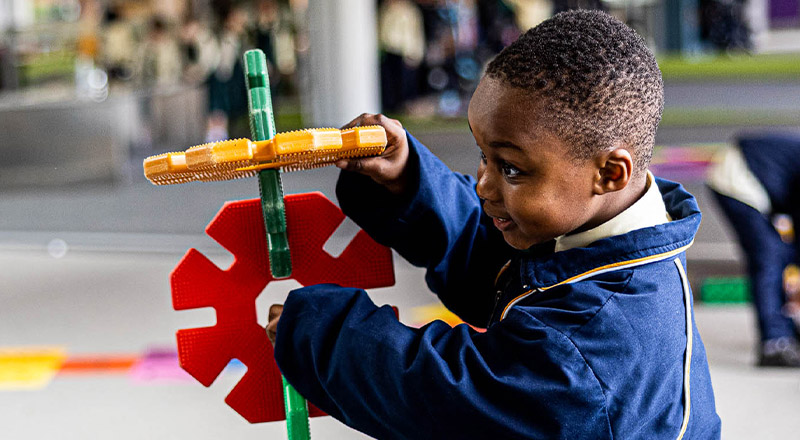 Student playing with building blocks at St Francis of Assisi Catholic Primary School Glendenning