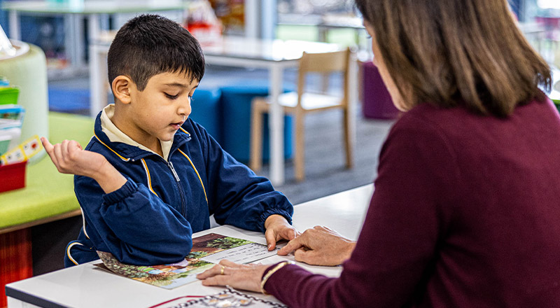 Teacher and student at St Francis of Assisi Catholic Primary School Glendenning