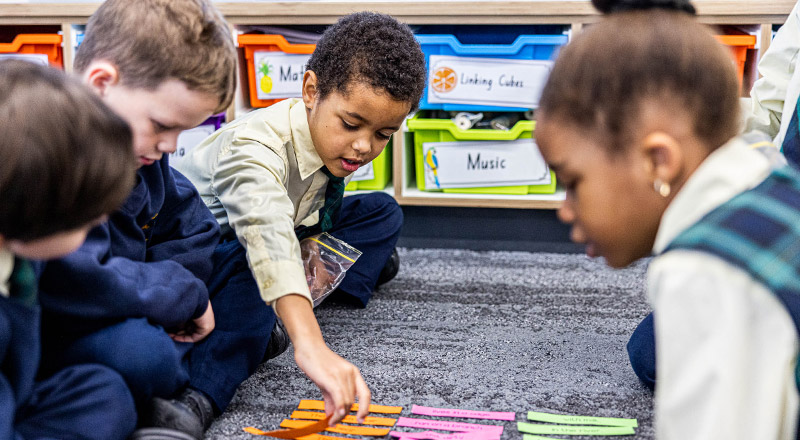 Children on floor at St Francis of Assisi Catholic Primary School Glendenning