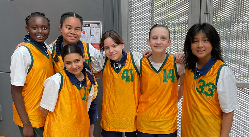 Children in basketball uniforms at St Francis of Assisi Catholic Primary School Glendenning
