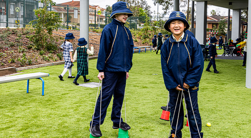 Students on play equipment at St Francis of Assisi Catholic Primary School Glendenning
