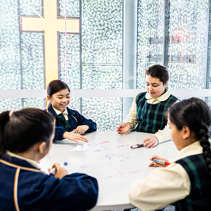 students at desk at St Francis of Assisi Catholic Primary School Glendenning