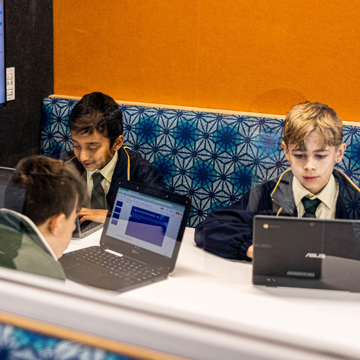 Children in booth at St Francis of Assisi Catholic Primary School Glendenning