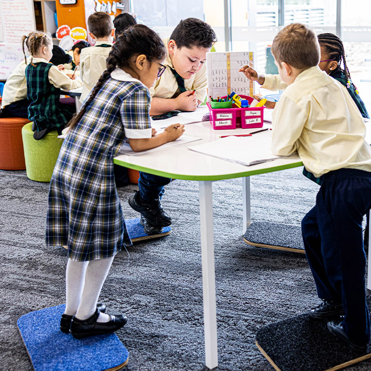 Children at desk at St Francis of Assisi Catholic Primary School Glendenning
