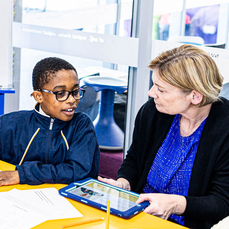 Teacher and student at St Francis of Assisi Catholic Primary School Glendenning