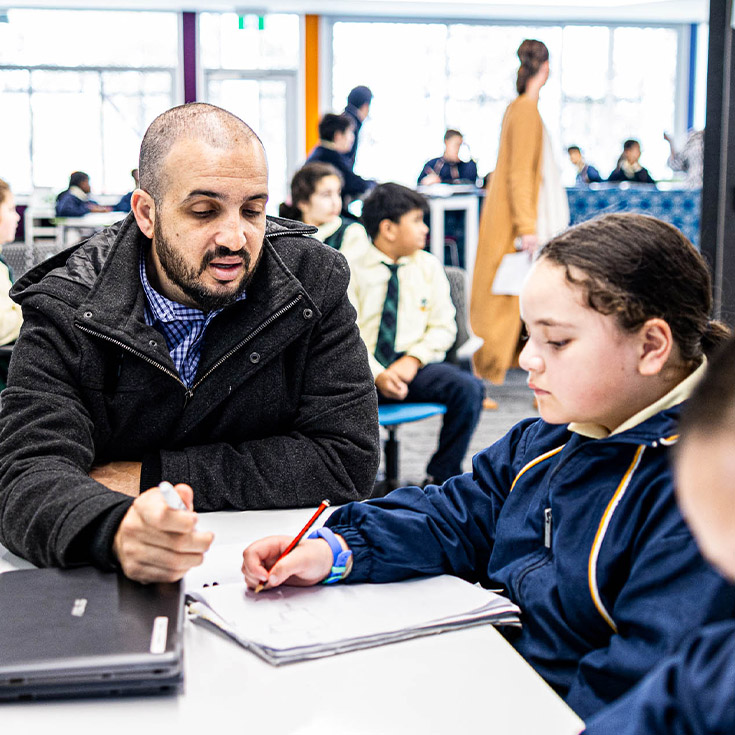 Teacher and student at St Francis of Assisi Catholic Primary School Glendenning