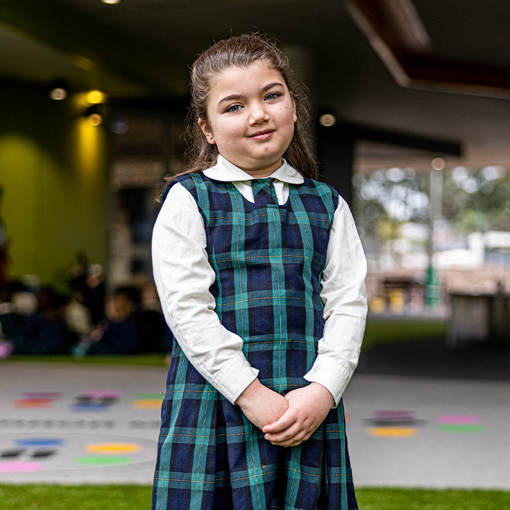 Girl in uniform at St Francis of Assisi Catholic Primary School Glendenning