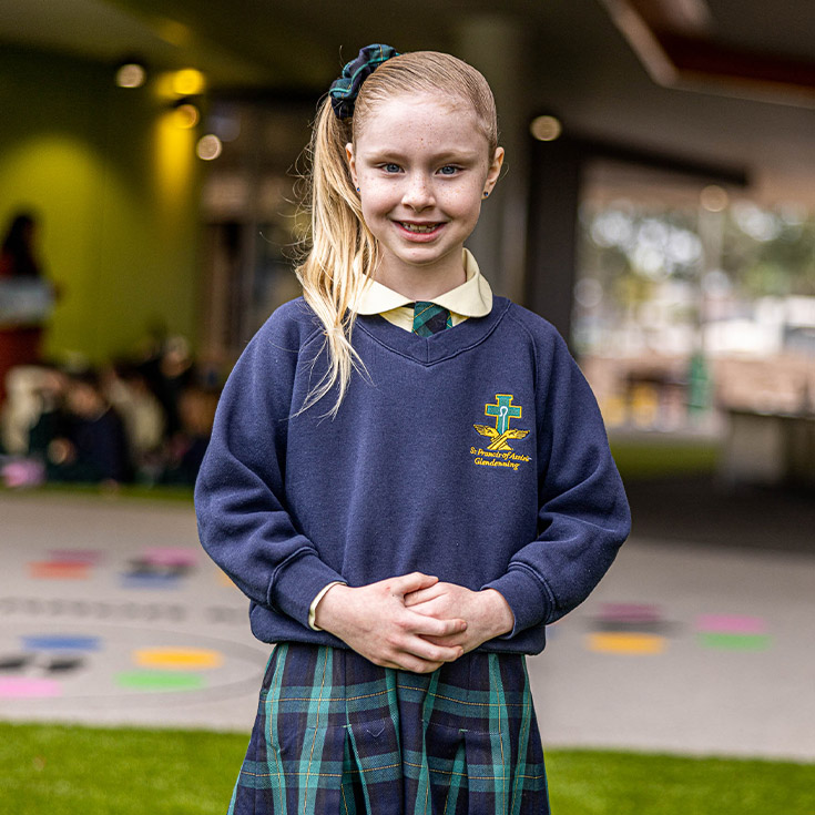 Girl in uniform at St Francis of Assisi Catholic Primary School Glendenning